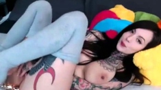 Tattooed Naughty Chick masturbating with her Dildo