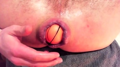 Guy pushing anal balls out of his ass - huge gape